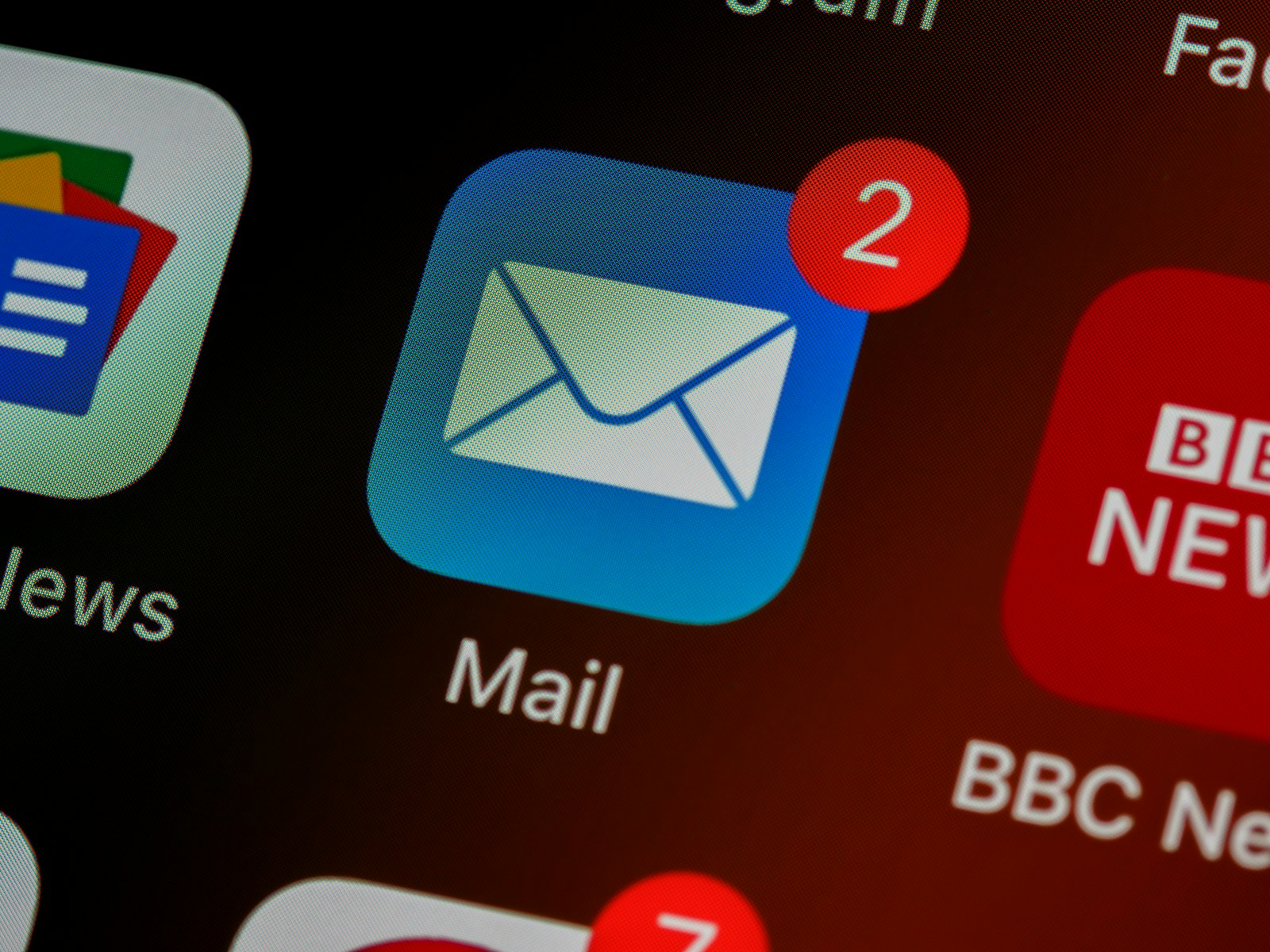 Close-up of a mail app icon on a smartphone home screen